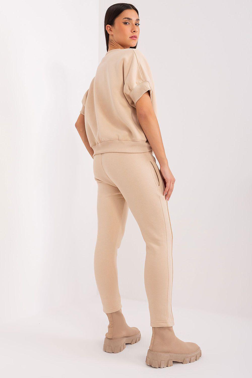 Beige two-piece tracksuit set with short-sleeve sweatshirt and jogger pants