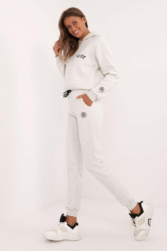 Light grey hoodie and jogger set, side logo patches, drawstring waist, tapered legs