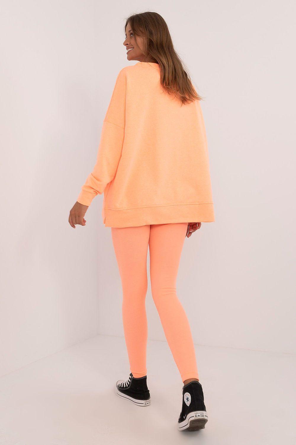 Orange sweatshirt and leggings set, back view with crewneck hem details