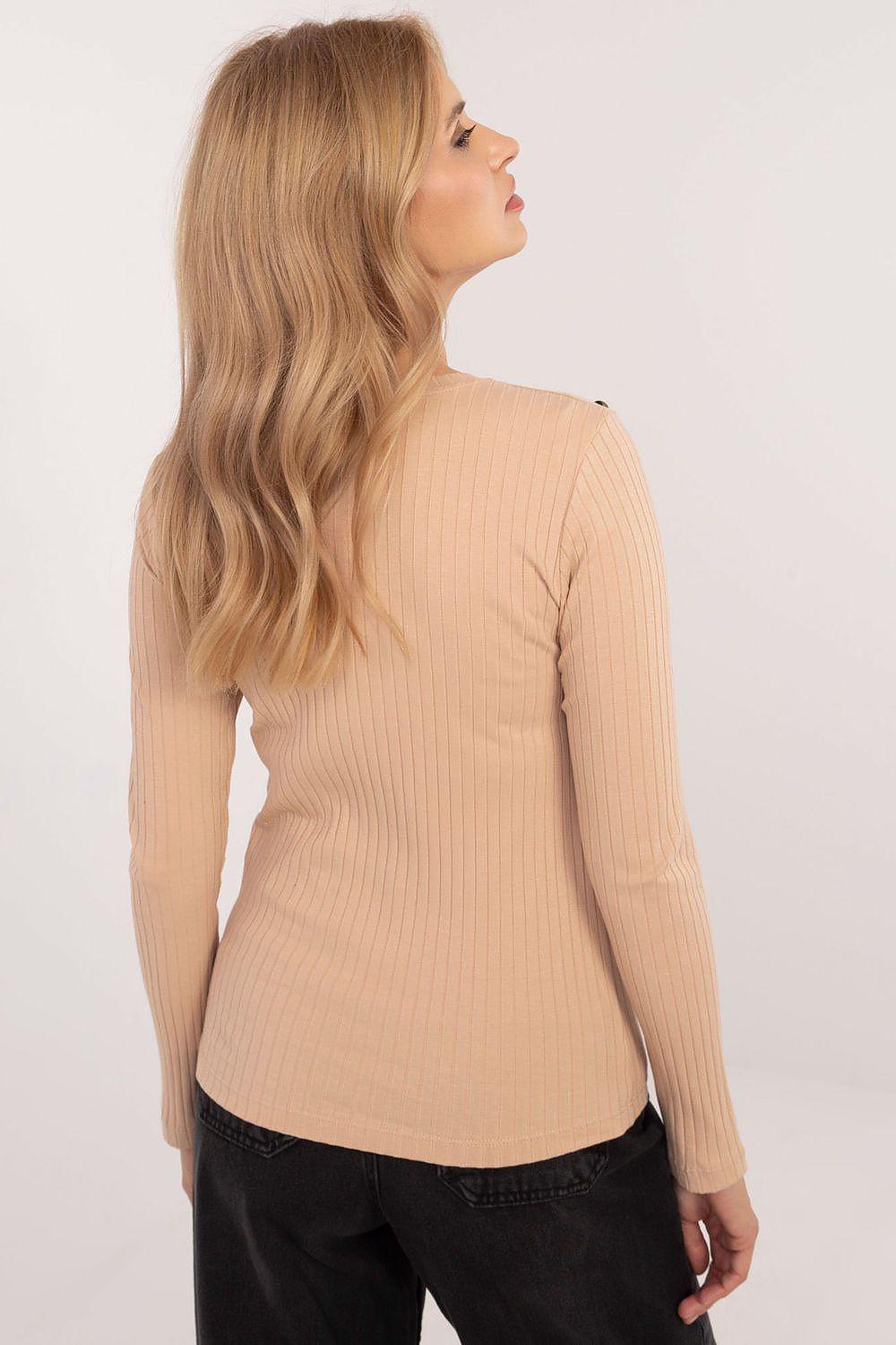 Relevance ribbed blouse in beige, long sleeves and crew back with shoulder detail.