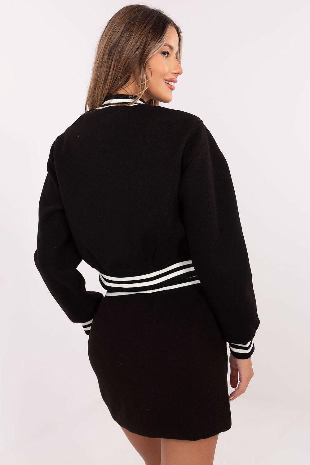 Black varsity mini skirt and jacket set, back view with white striped band