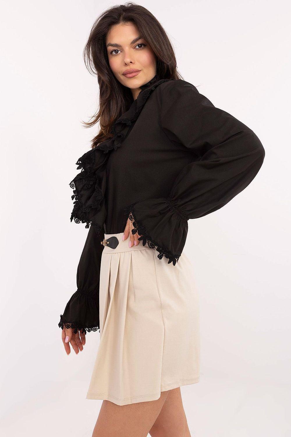 Beige pleated skort with belt and pleated hem, side view