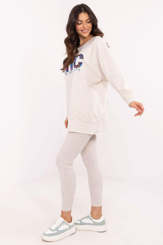 Heather beige loungewear set shown from side: long-sleeve sweatshirt and leggings