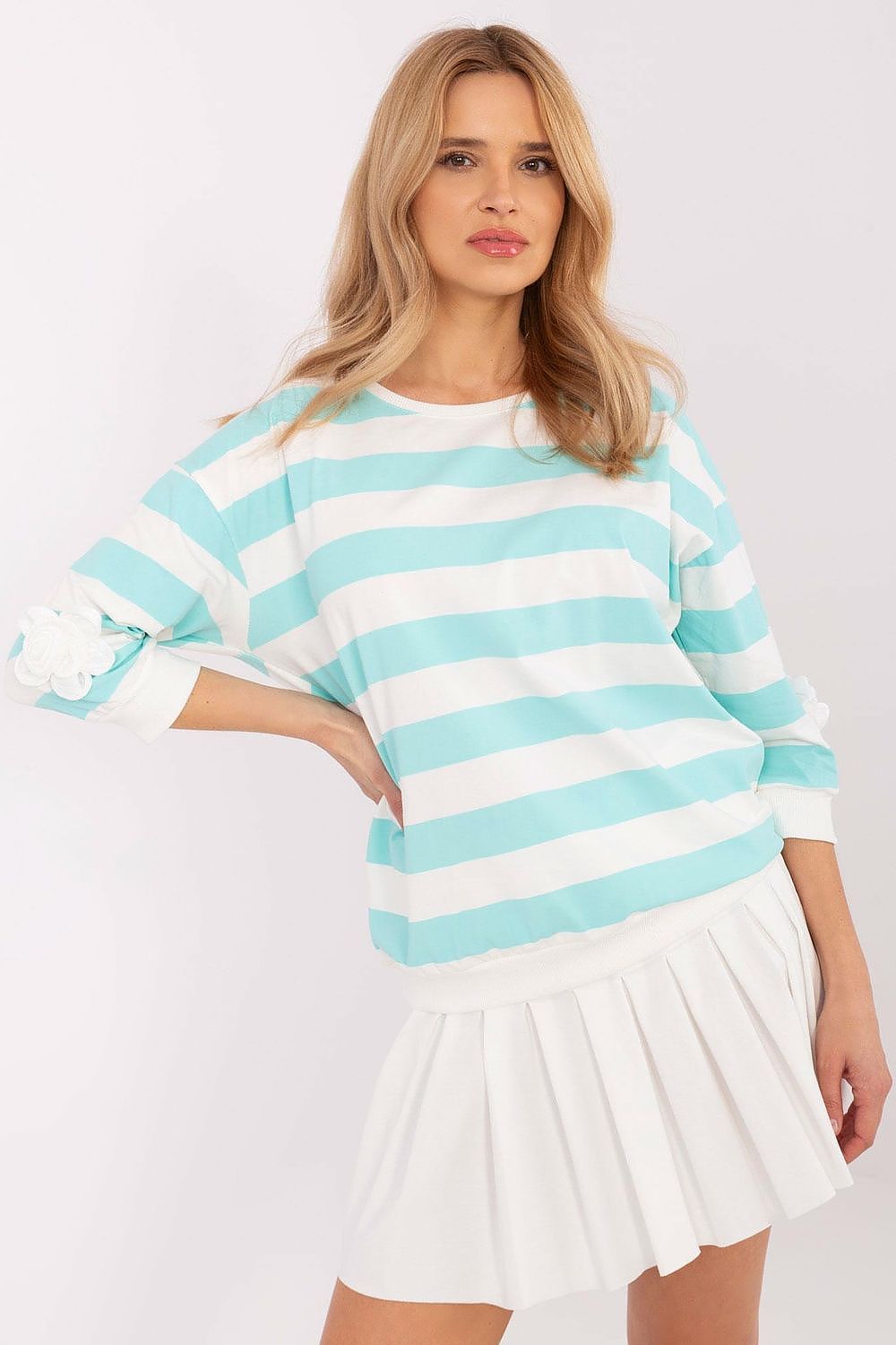 Light blue and white striped blouse with floral cuff detail