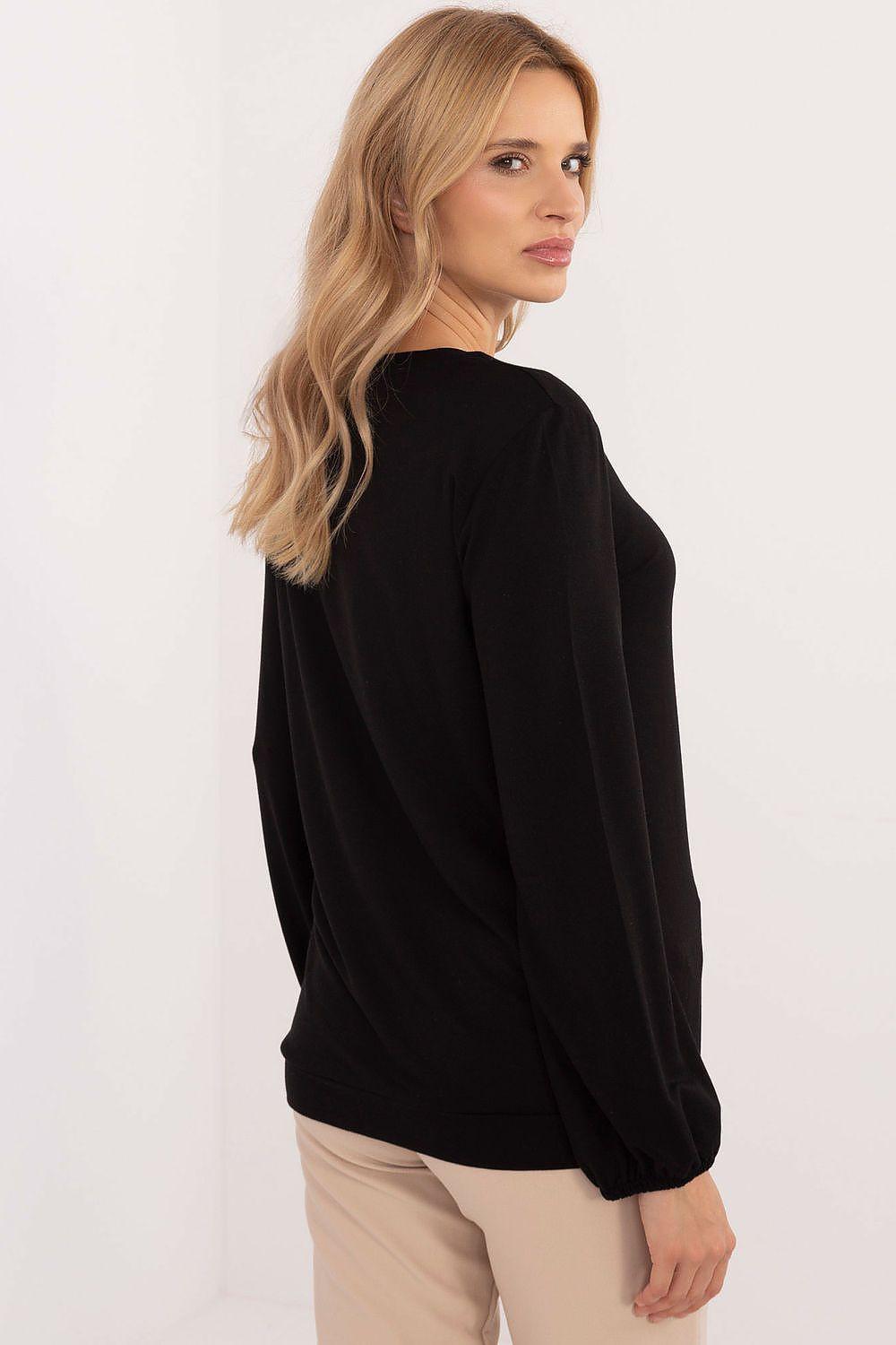 Black long-sleeve blouse, back view with elastic cuffs