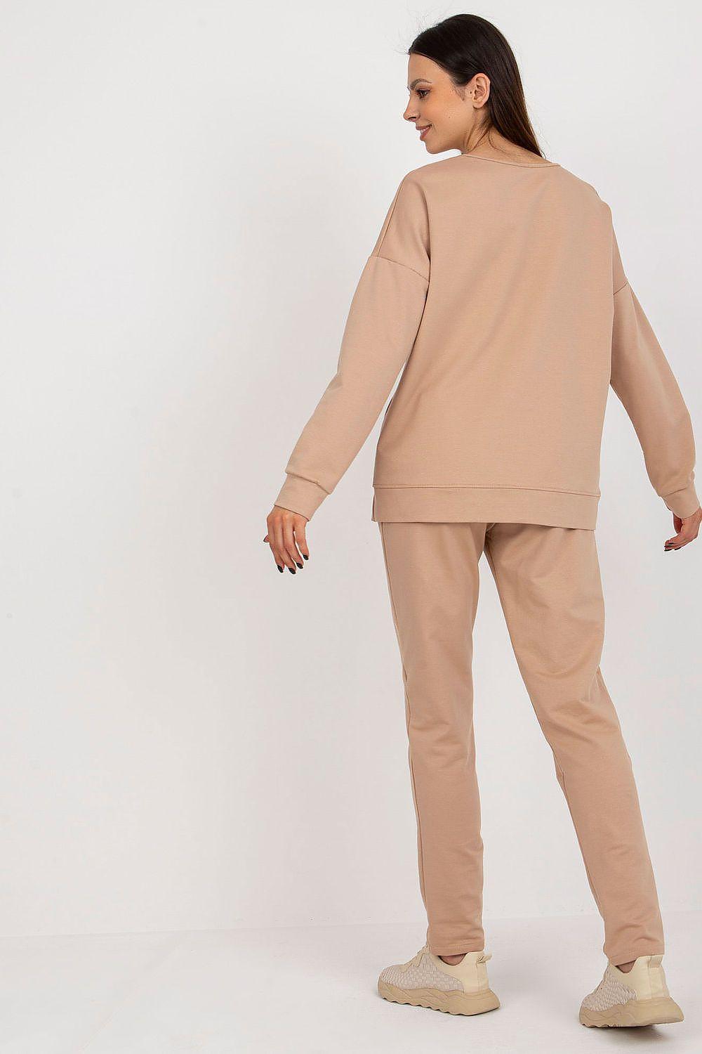 Beige two-piece sweatshirt and pants set from back view with elastic cuffs and waistband