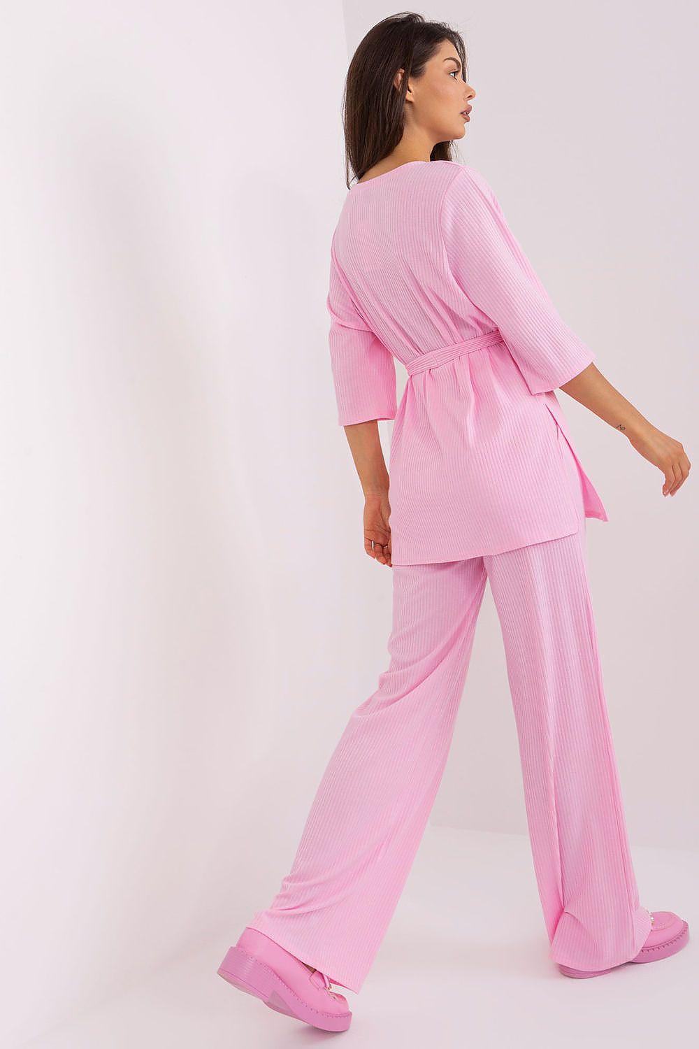 Pink ribbed knit matching set with tie waist top and wide-leg high-waist pants, back