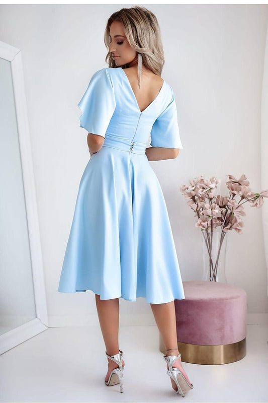 Light blue cocktail dress with open back V, short sleeves, fitted waist, flared skirt