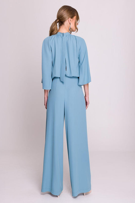 Blue wide-leg pants set, back view, flowing cape sleeves and tied keyhole detail