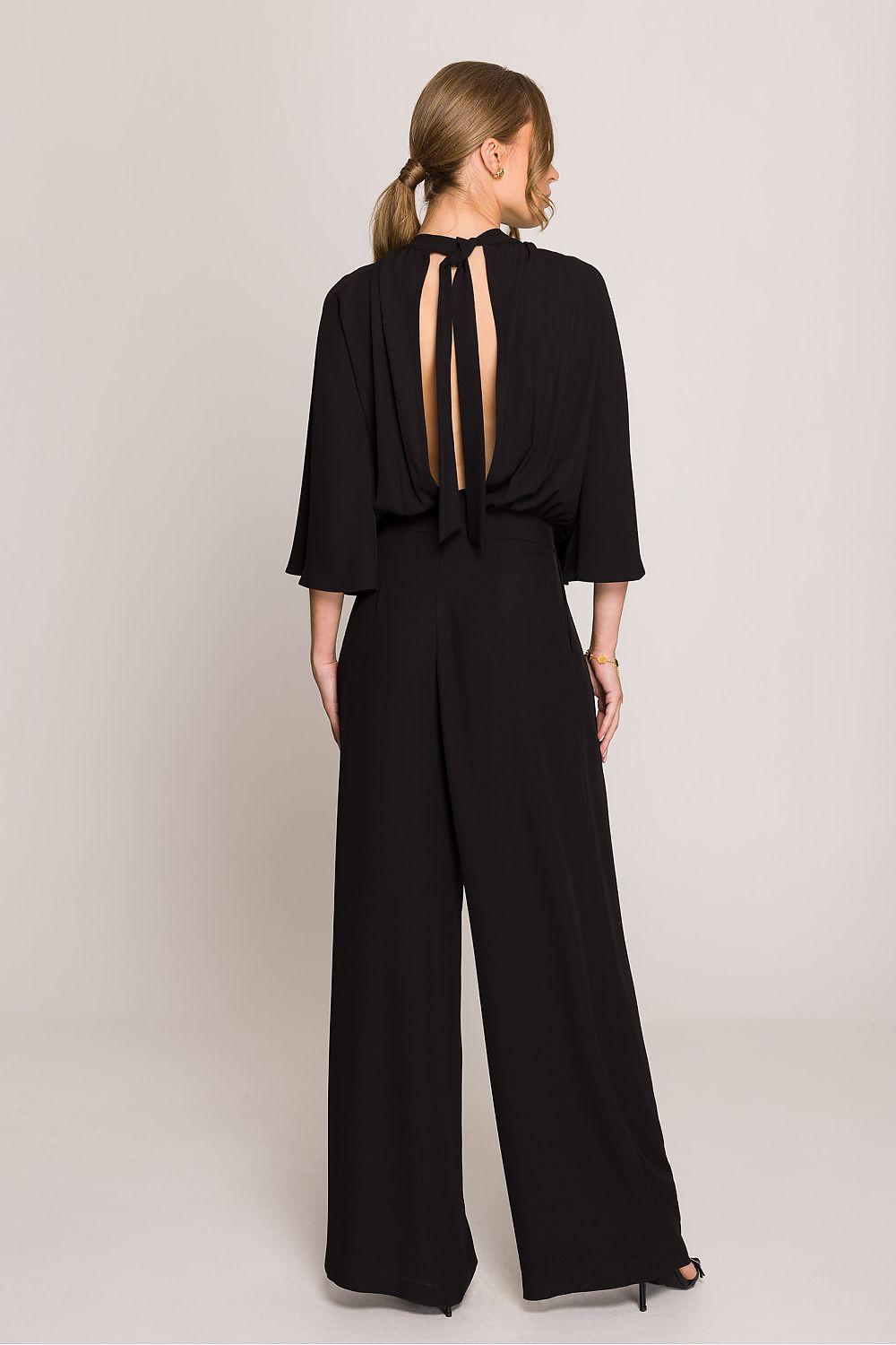 Black wide-leg suit, back view with keyhole cutout and open back strap detail