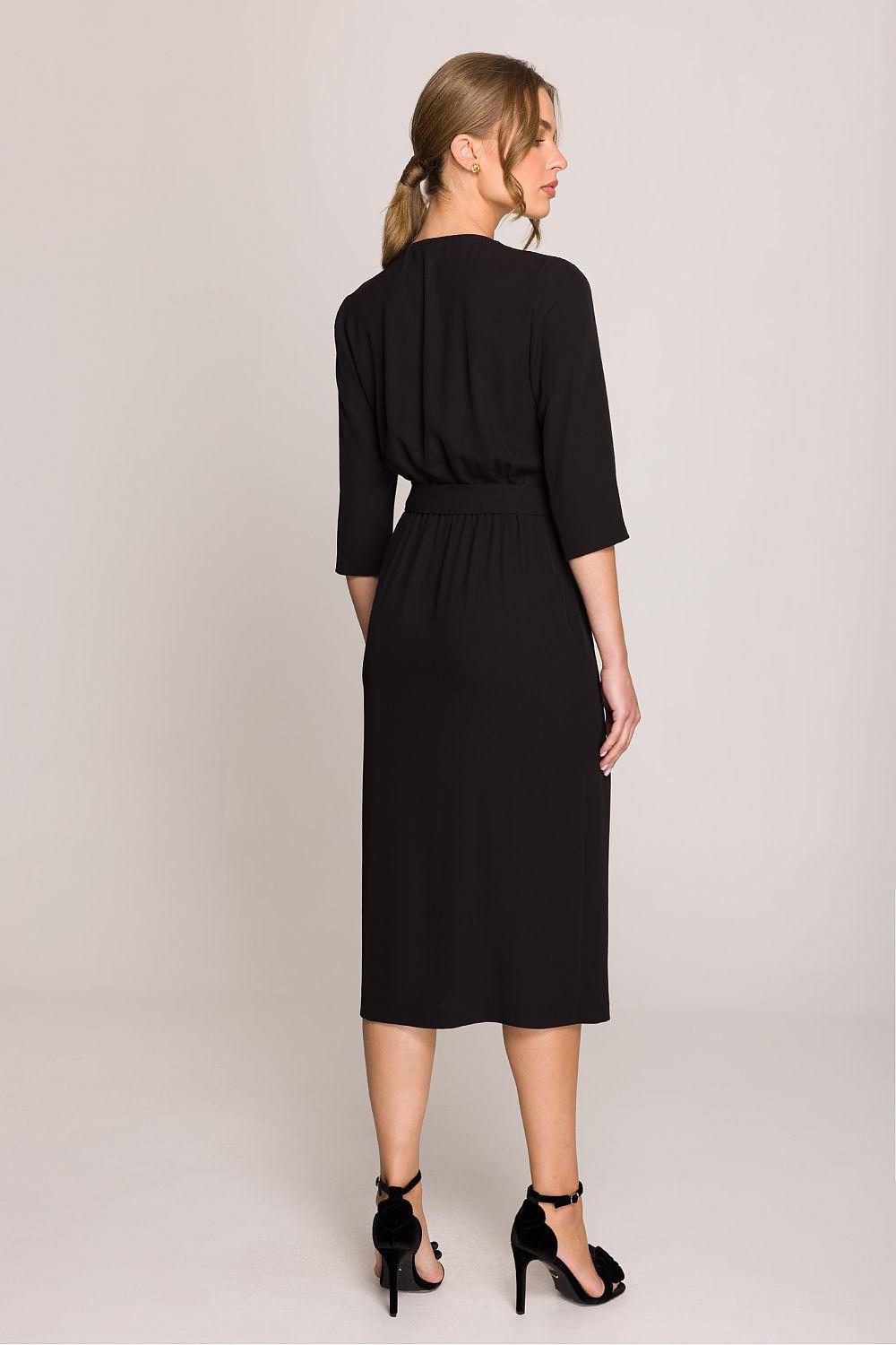 Black day dress with tied waist, three-quarter sleeves, knee-length, back view