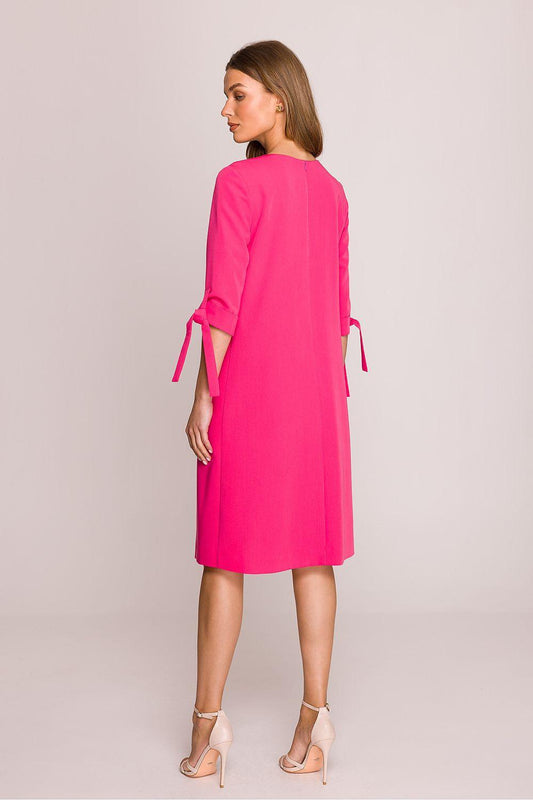 Pink daydress with 3/4 sleeves and side-tie ribbons, back view, knee length