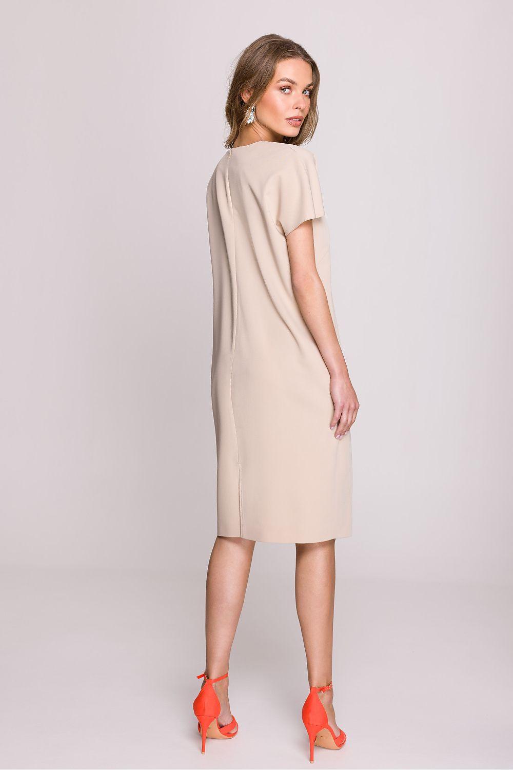 Beige daydress back view with short sleeves and straight knee-length hem