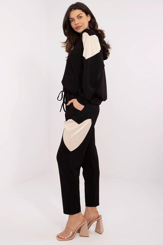 Black hoodie and slim jogger pants set with cream side and sleeve patches