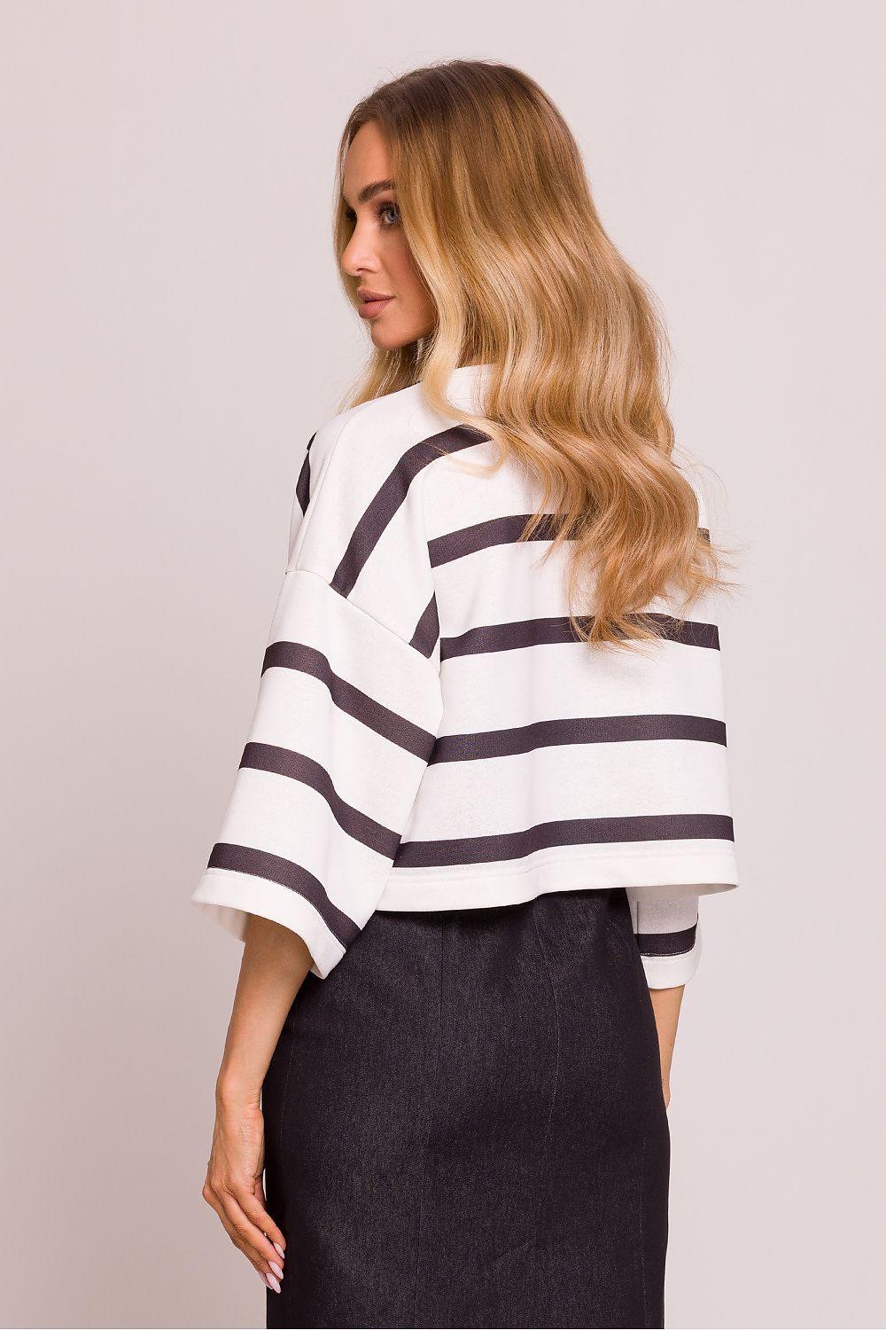 Black and white striped blouse, side view, wide sleeves and round neckline
