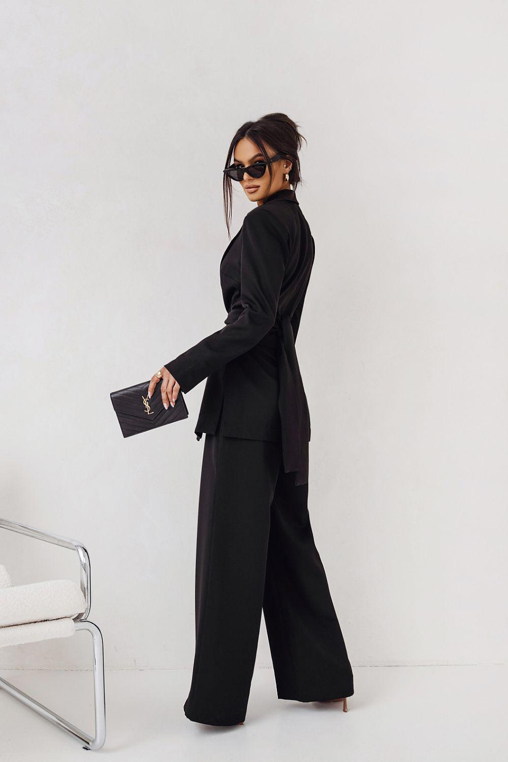 Black blazer and wide-leg trousers set, side view with long sleeves