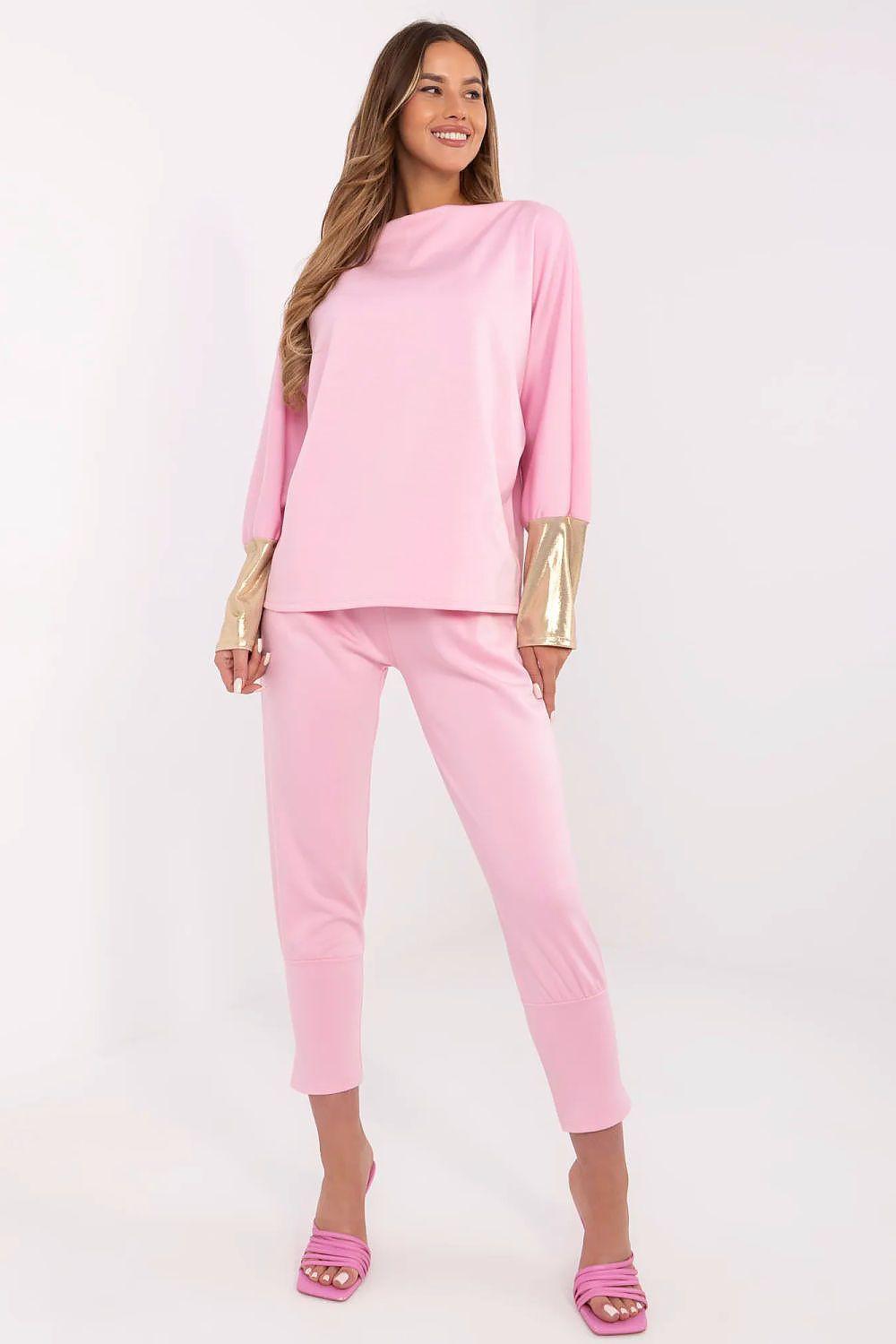 Women’s pink two-piece set with gold cuff details, long sleeve top and cuffed pants