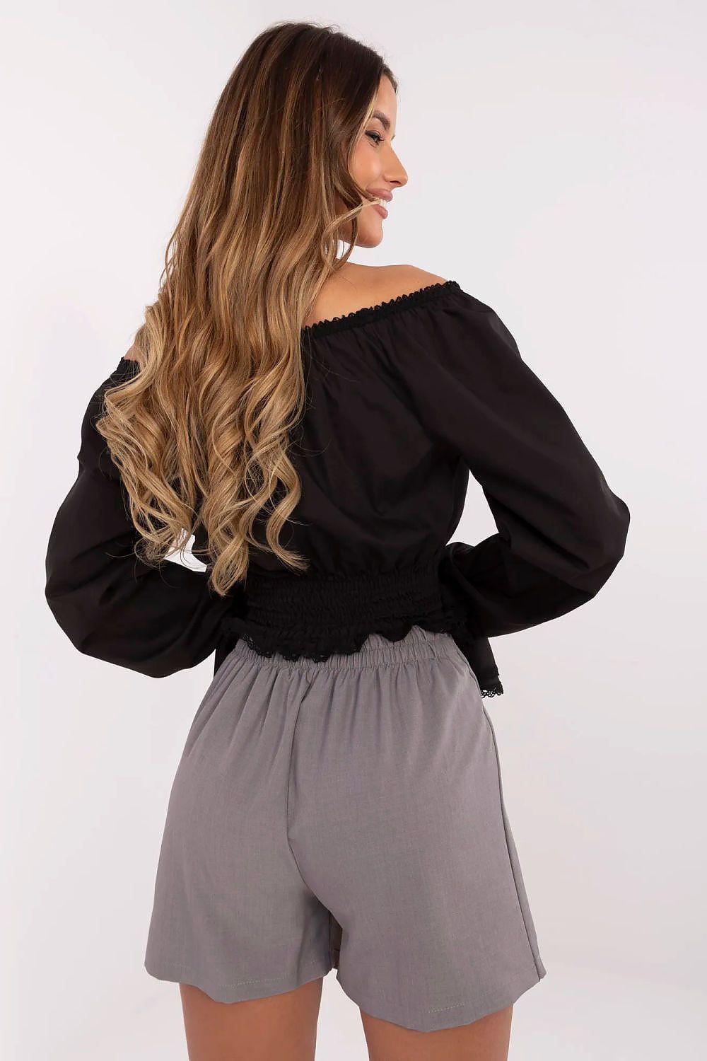 Grey skort with pleated overlay and attached shorts, side view