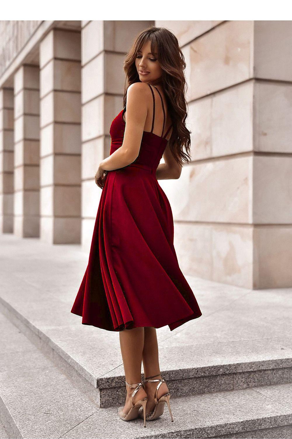Red A-line midi evening dress with thin spaghetti straps, fitted waist, pleated skirt