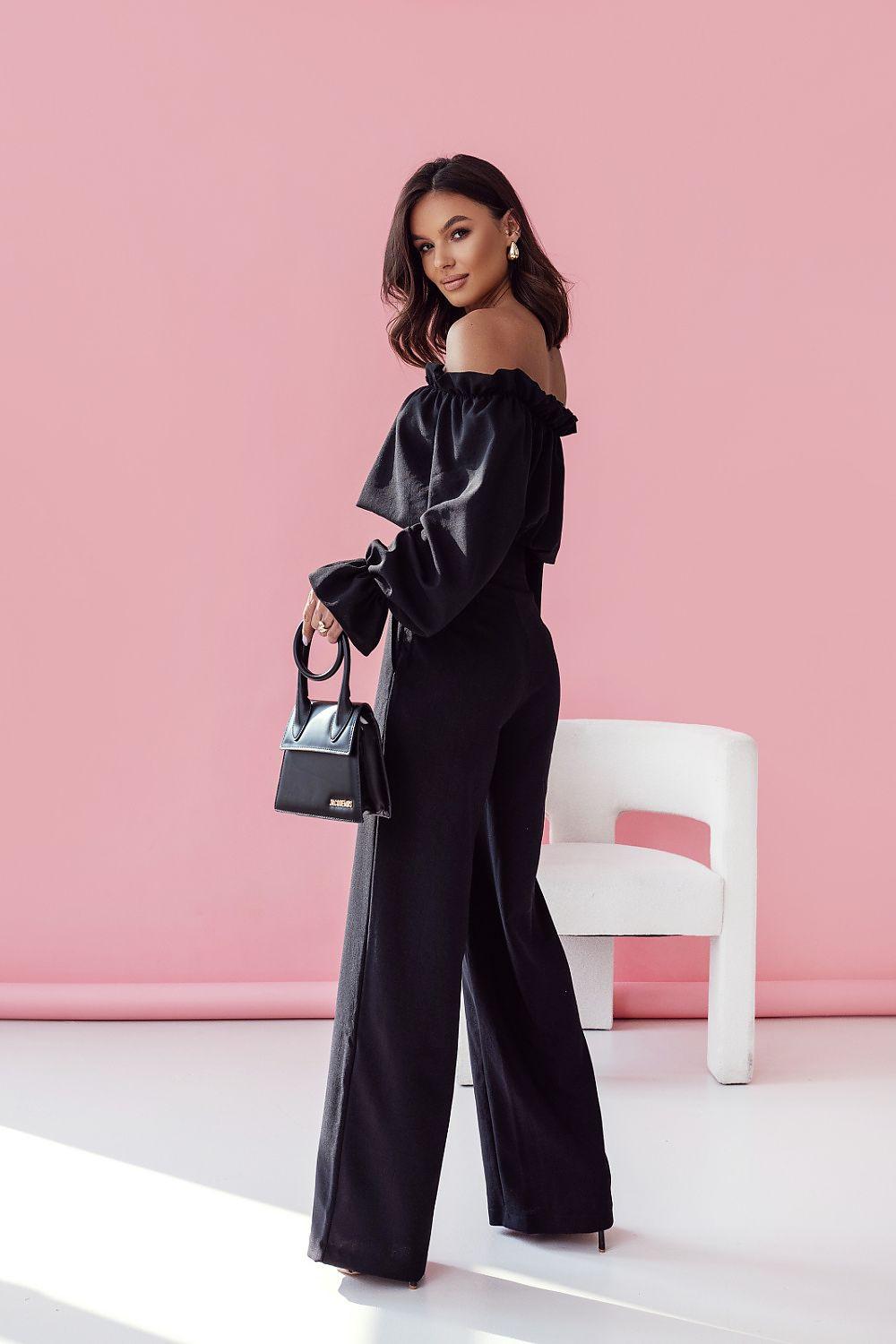 LaBalancia two-piece set in black with off-shoulder blouse and wide-leg trousers, side view