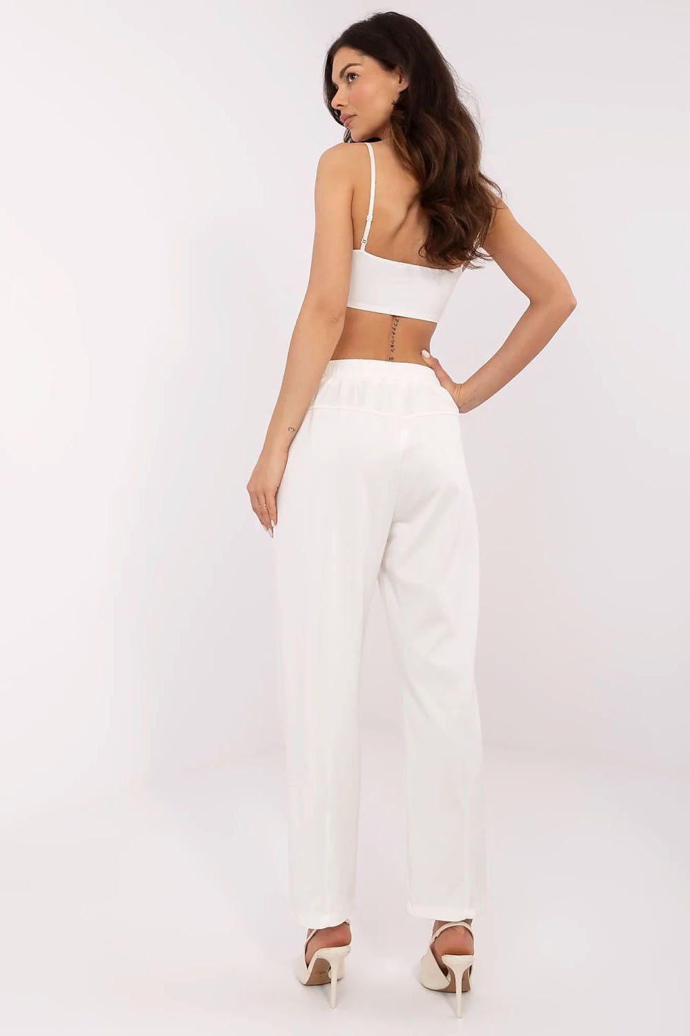 Off-white tracksuit trousers, relaxed fit with elastic waist