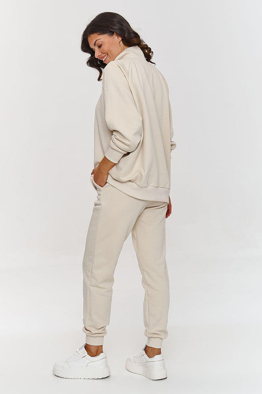 Beige hoodie and jogger set, side view, cuffed sleeves and tapered jogger pants