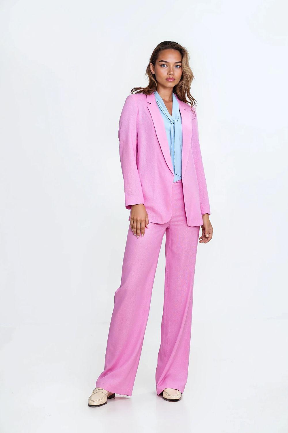 Light blue collared blouse with V-neck, under pink blazer