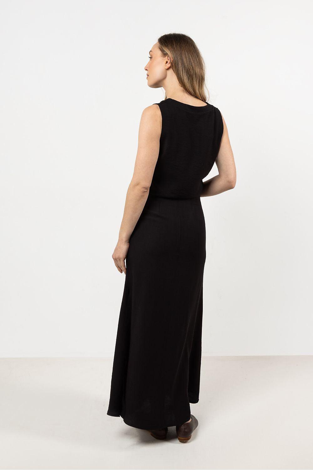 Sleeveless V-neck blouse in black, back view with fitted waist seam