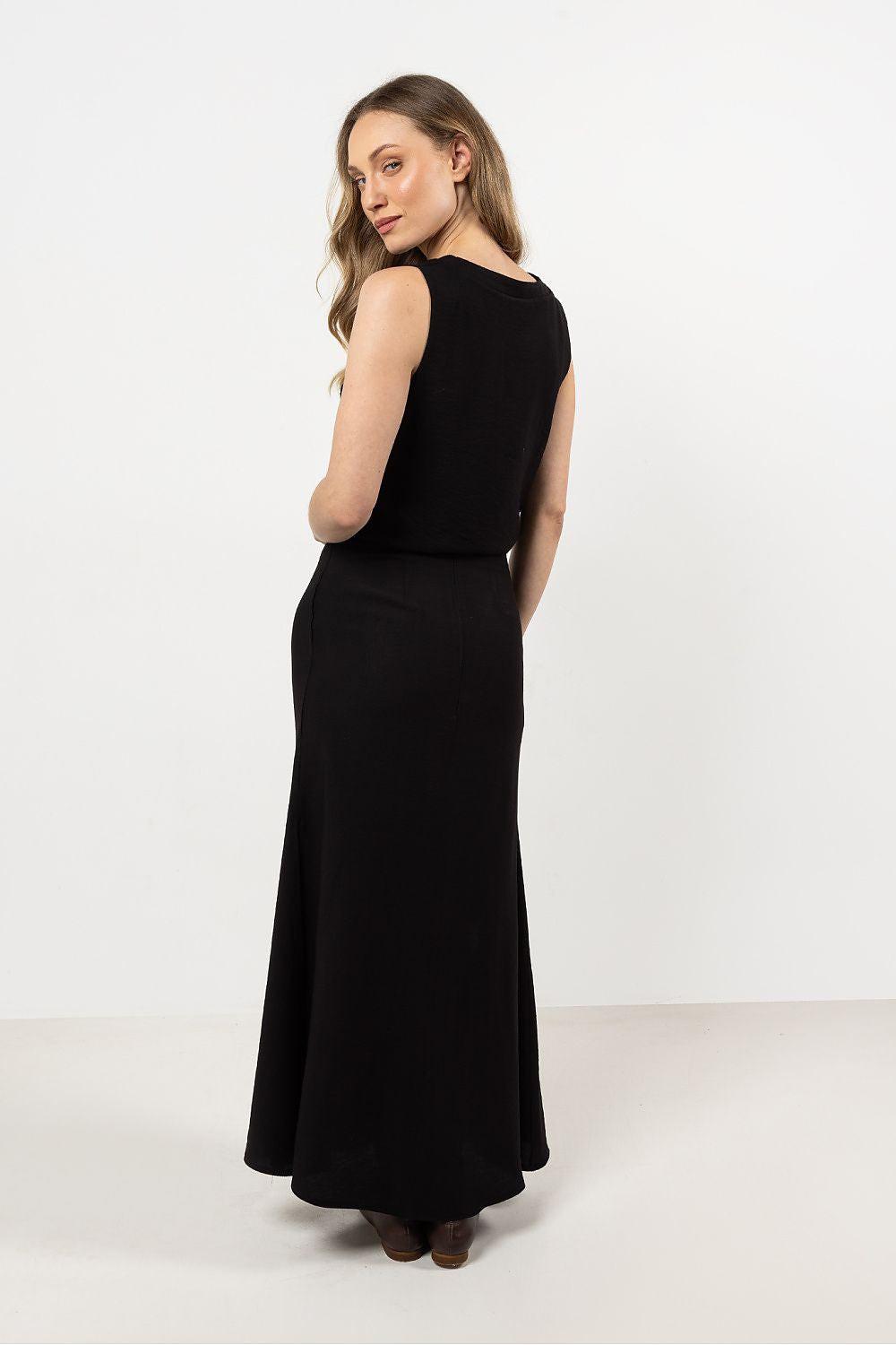 Black long skirt, back view with flowing ankle-length hem