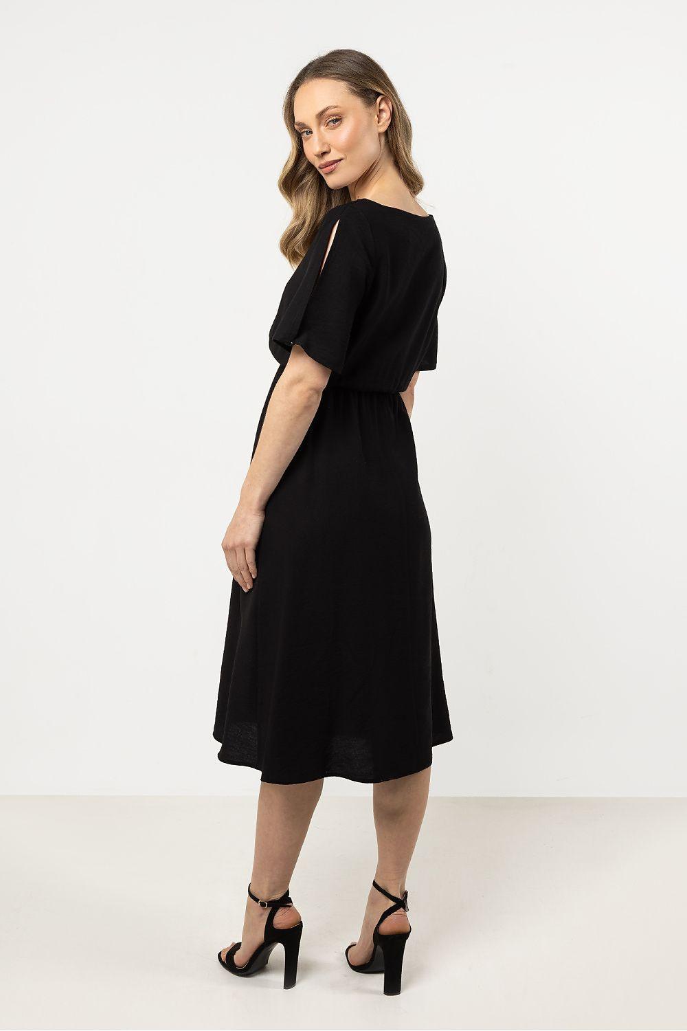 Black daydress with gathered waist, short sleeves, side view knee-length skirt