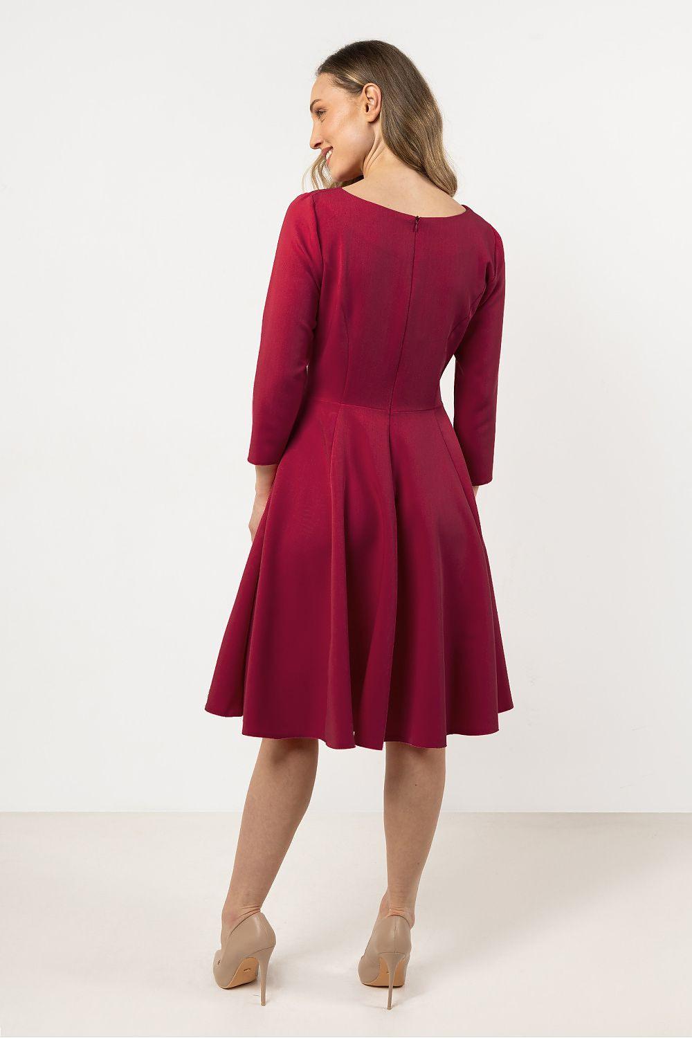 Pink daydress with 3/4 sleeves, back view with pleated skirt flare