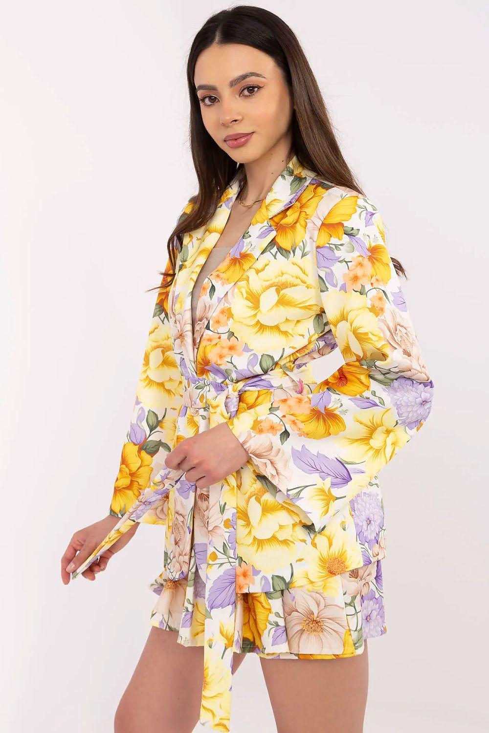 Yellow and purple floral blazer and shorts set, side view with tie-waist jacket and ruffles