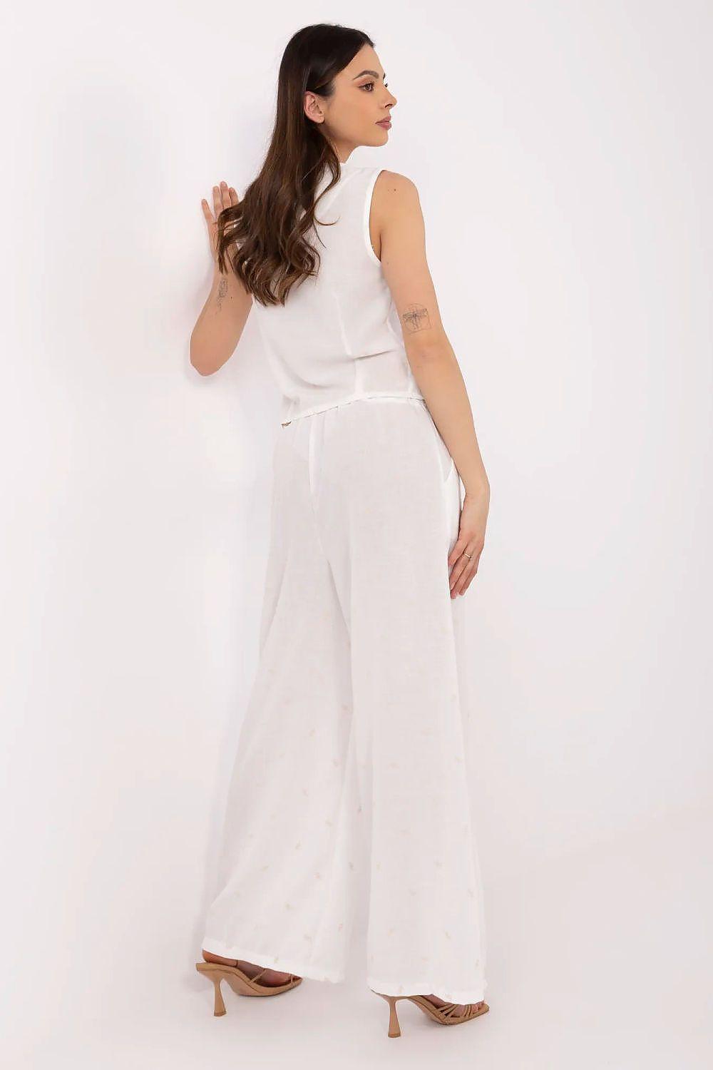 White sleeveless top and wide-leg pants set, side view