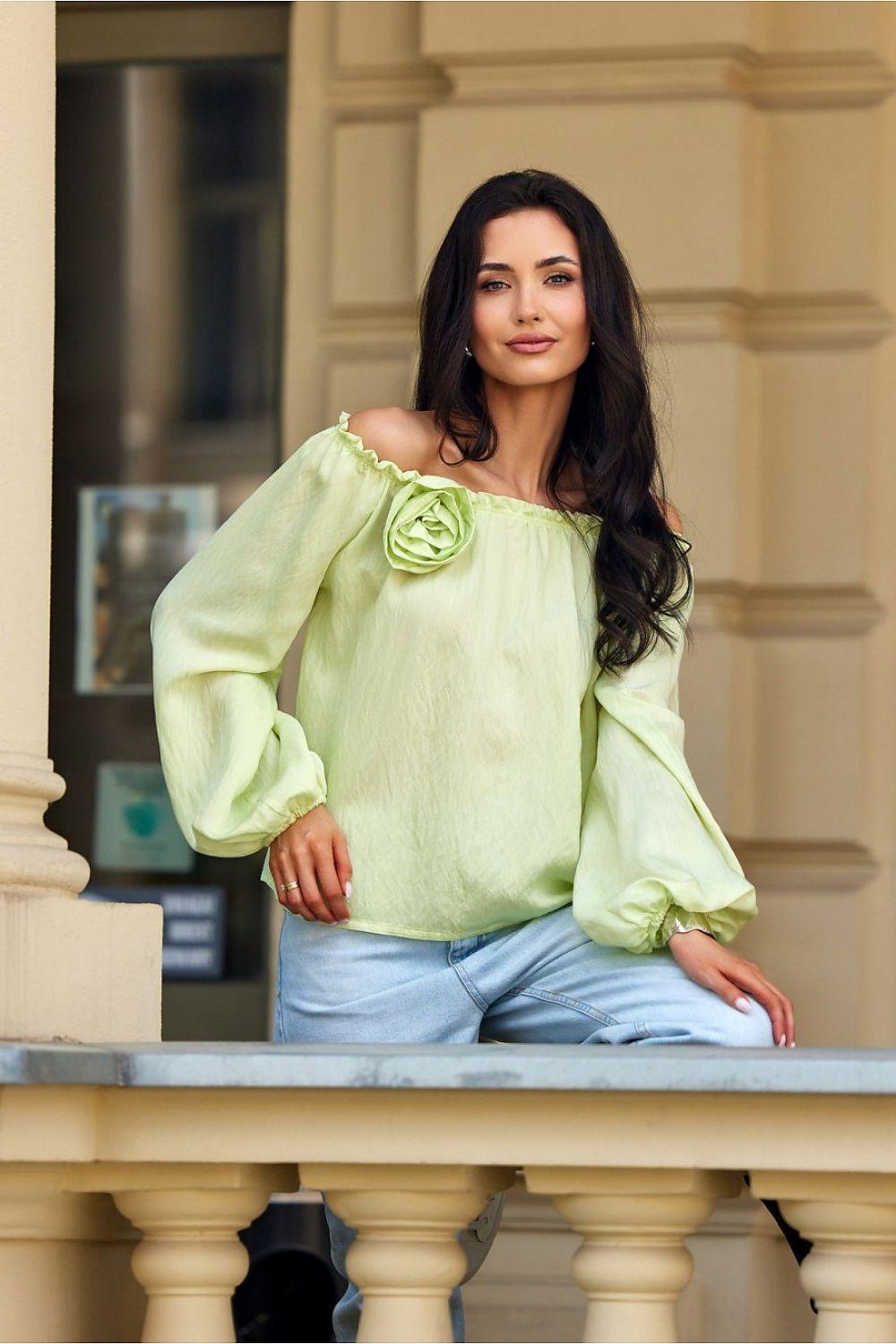 Light green off-shoulder blouse with rose applique, billowy long sleeves.
