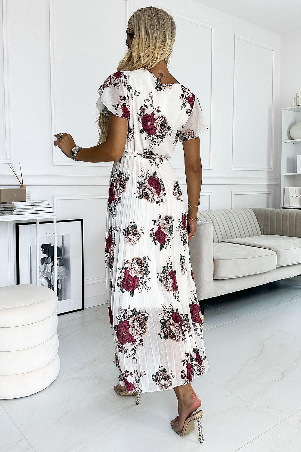 White floral midi dress back view with flutter sleeves, tied waist, pleated chiffon skirt