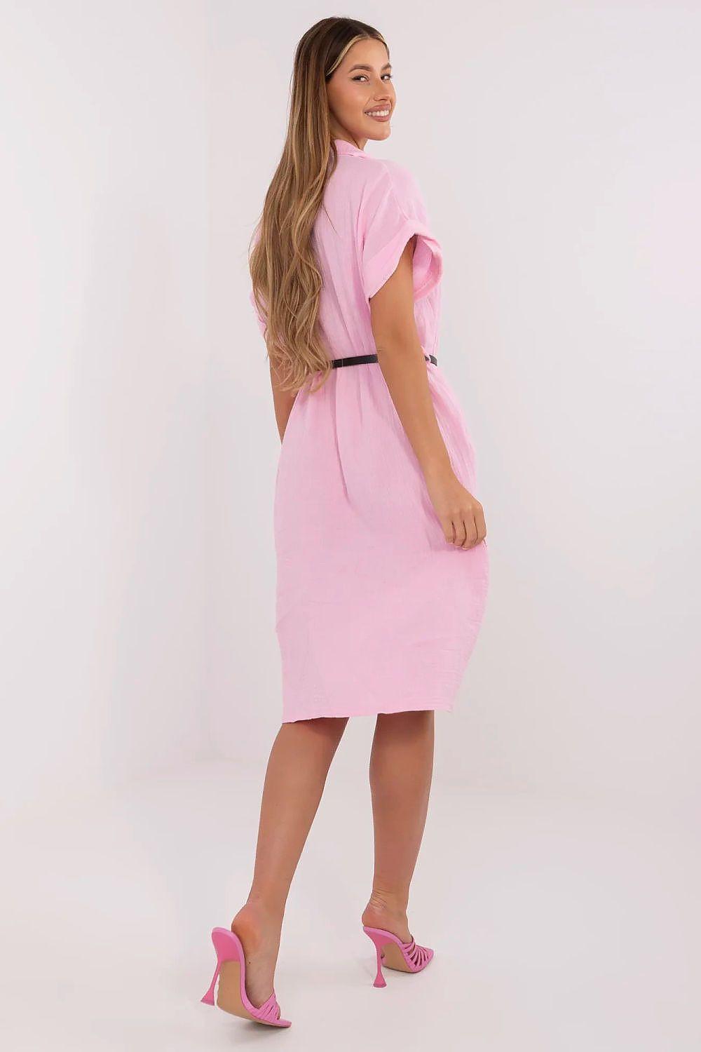 Pink shirt daydress with short sleeves, black belt, and knee-length skirt