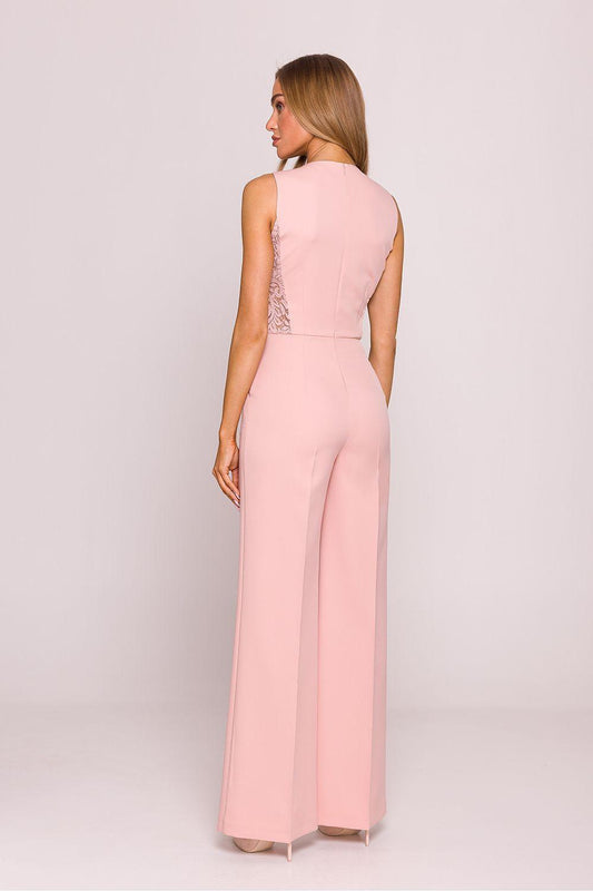 Pink sleeveless jumpsuit, back view, with lace inset at waist and wide legs.