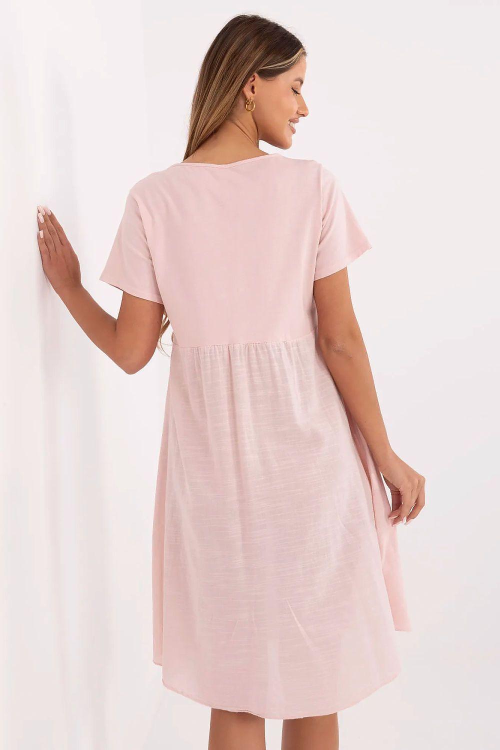 Pink cotton daydress back view with short sleeves and flared skirt