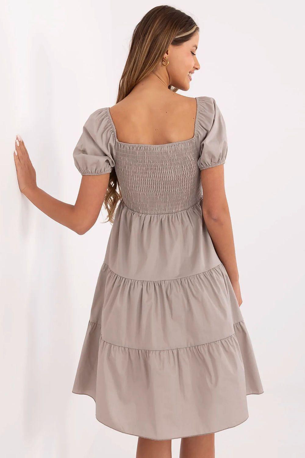 Beige tiered daydress with puff sleeves and gathered bodice, back view