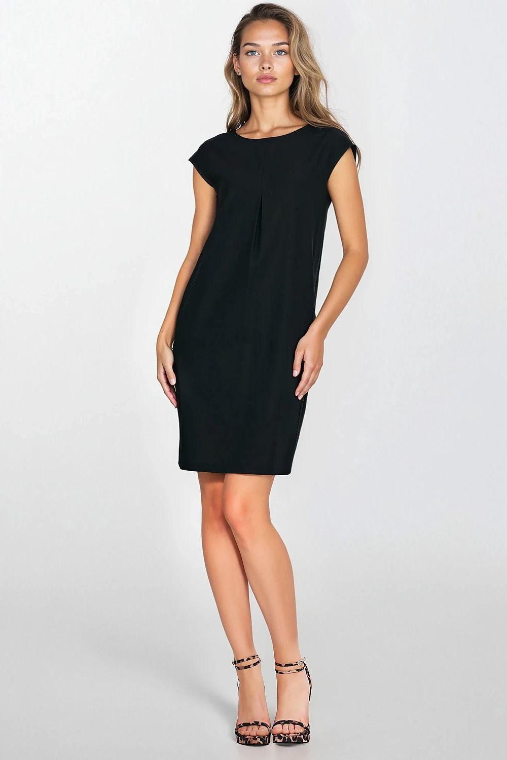 Black daydress by Nife, short cap sleeves, knee-length shift with center seam