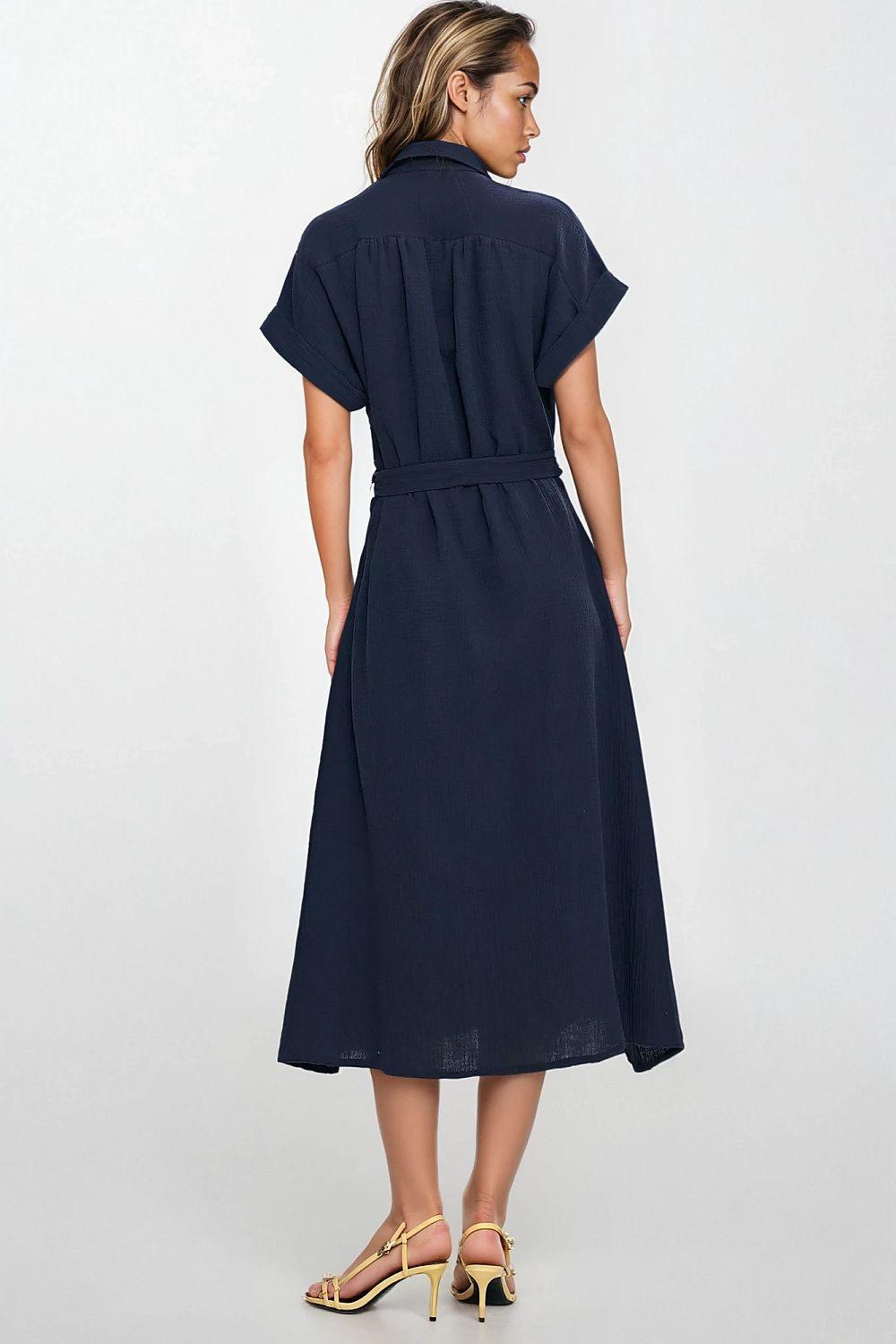 Navy linen daydress with back yoke detail, short sleeves, and tied waist belt.