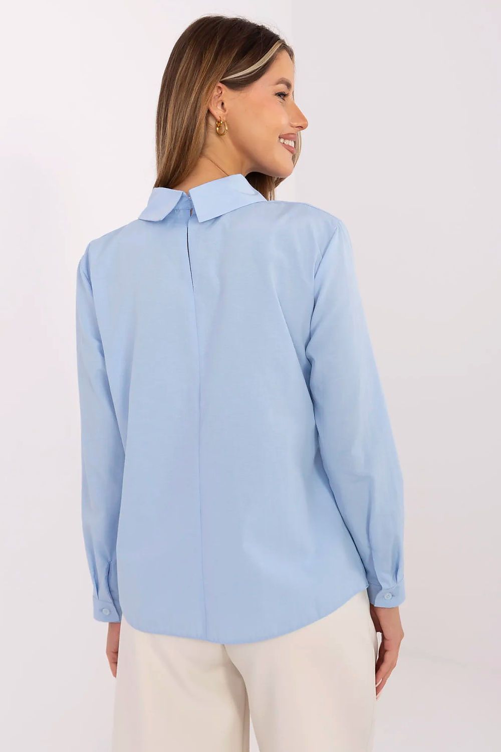 Back view of light blue cotton blouse with pointed collar and long sleeves