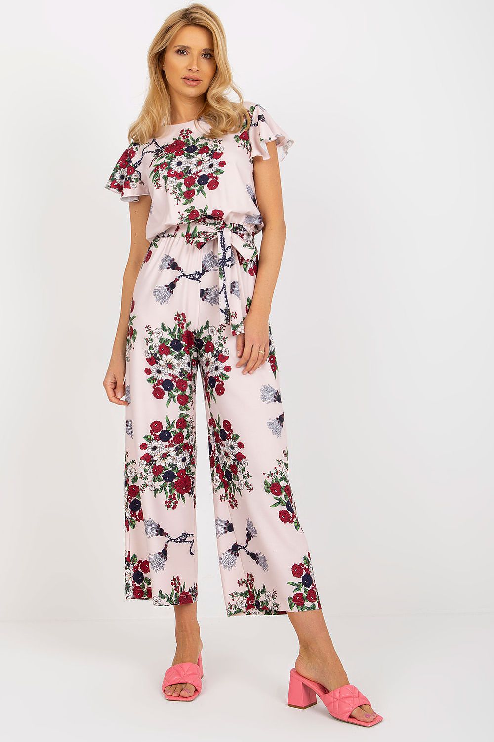 Pink floral jumpsuit with ruffle sleeves and tie waist, wide-leg cropped pants