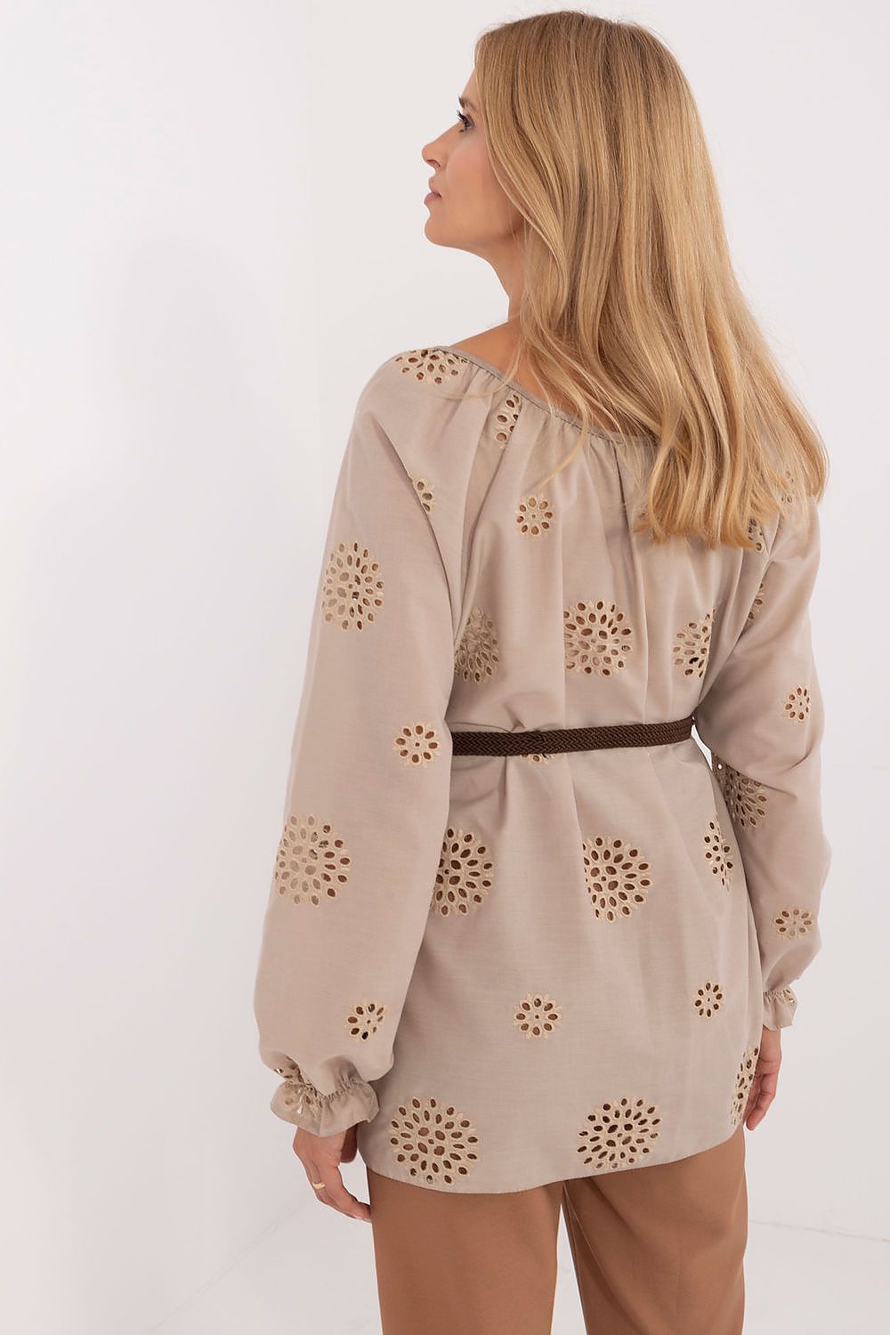 Beige boho cotton blouse with long sleeves, scattered eyelet motifs, and belt