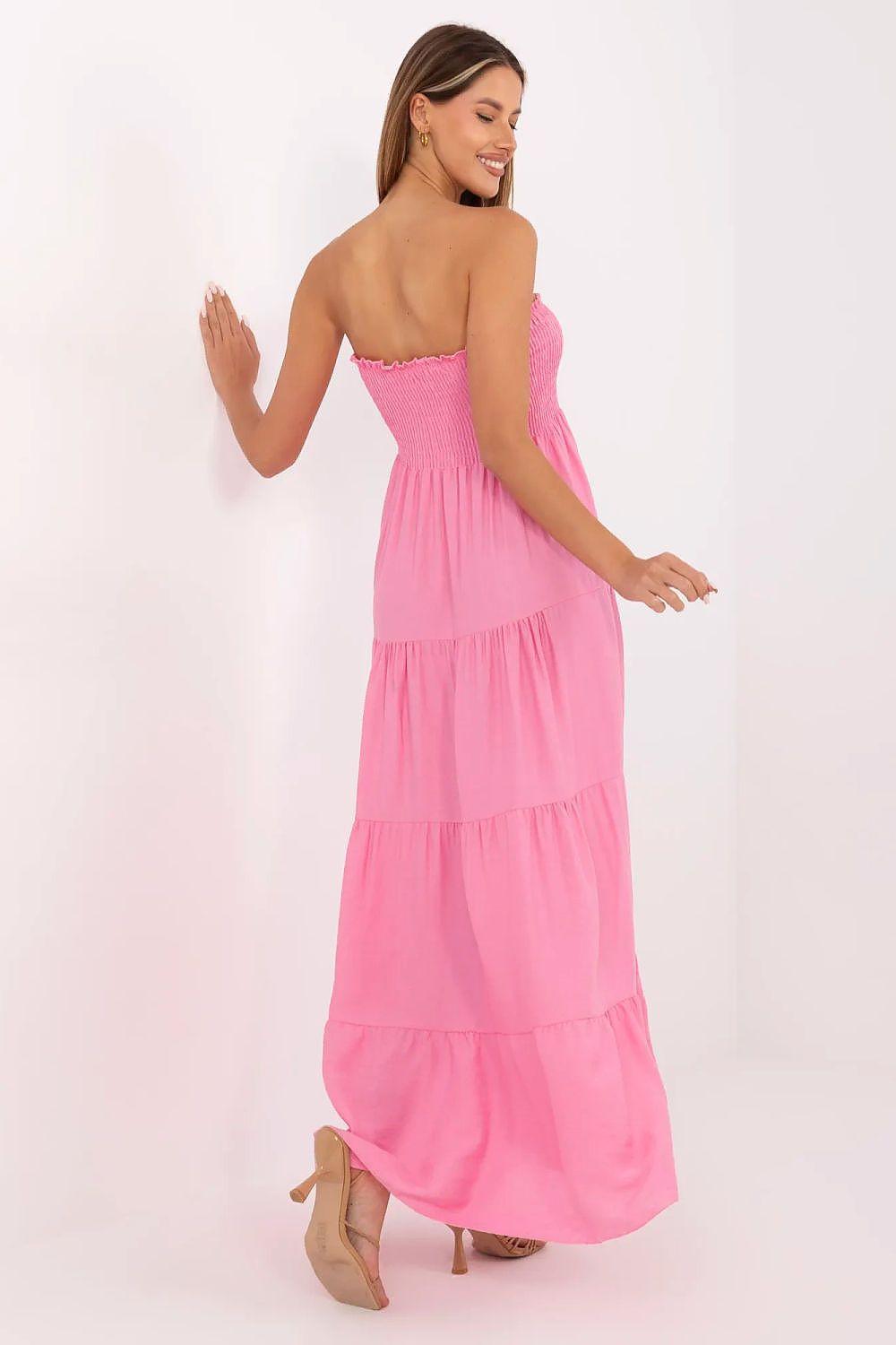 Pink strapless tiered daydress with smocked bodice and layered skirt, angled back