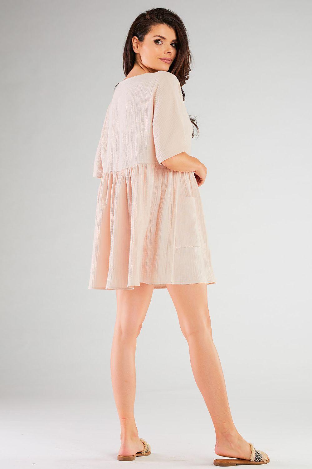 Beige daydress with V-neck, short sleeves, back gathers, flared skirt
