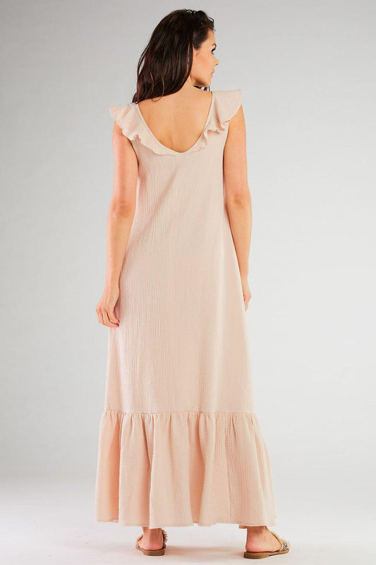 Beige sleeveless day dress with open back and ruffled cap sleeves, tiered hem