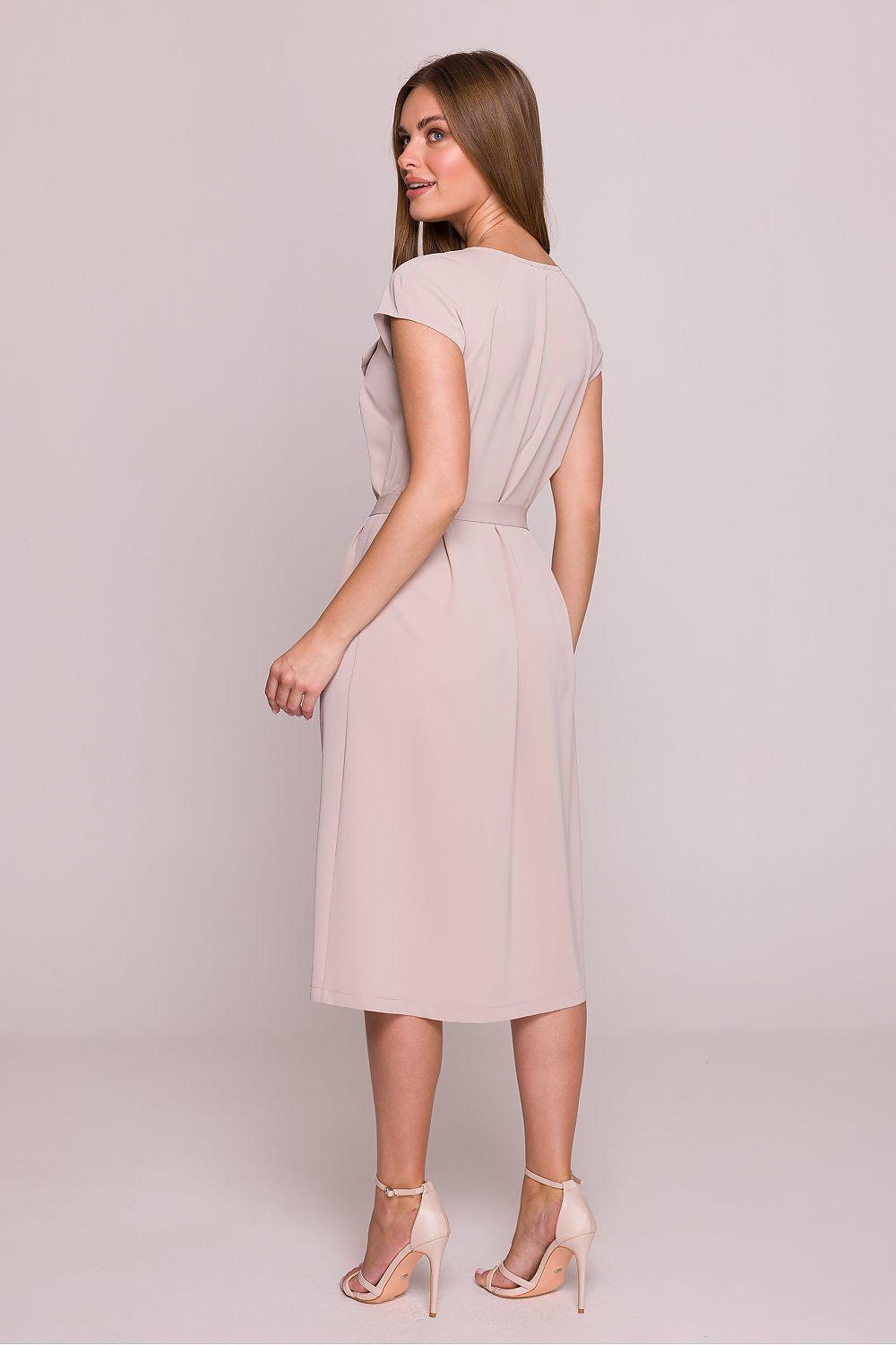 Blush pink V-back cocktail dress with gathered waist and short sleeves