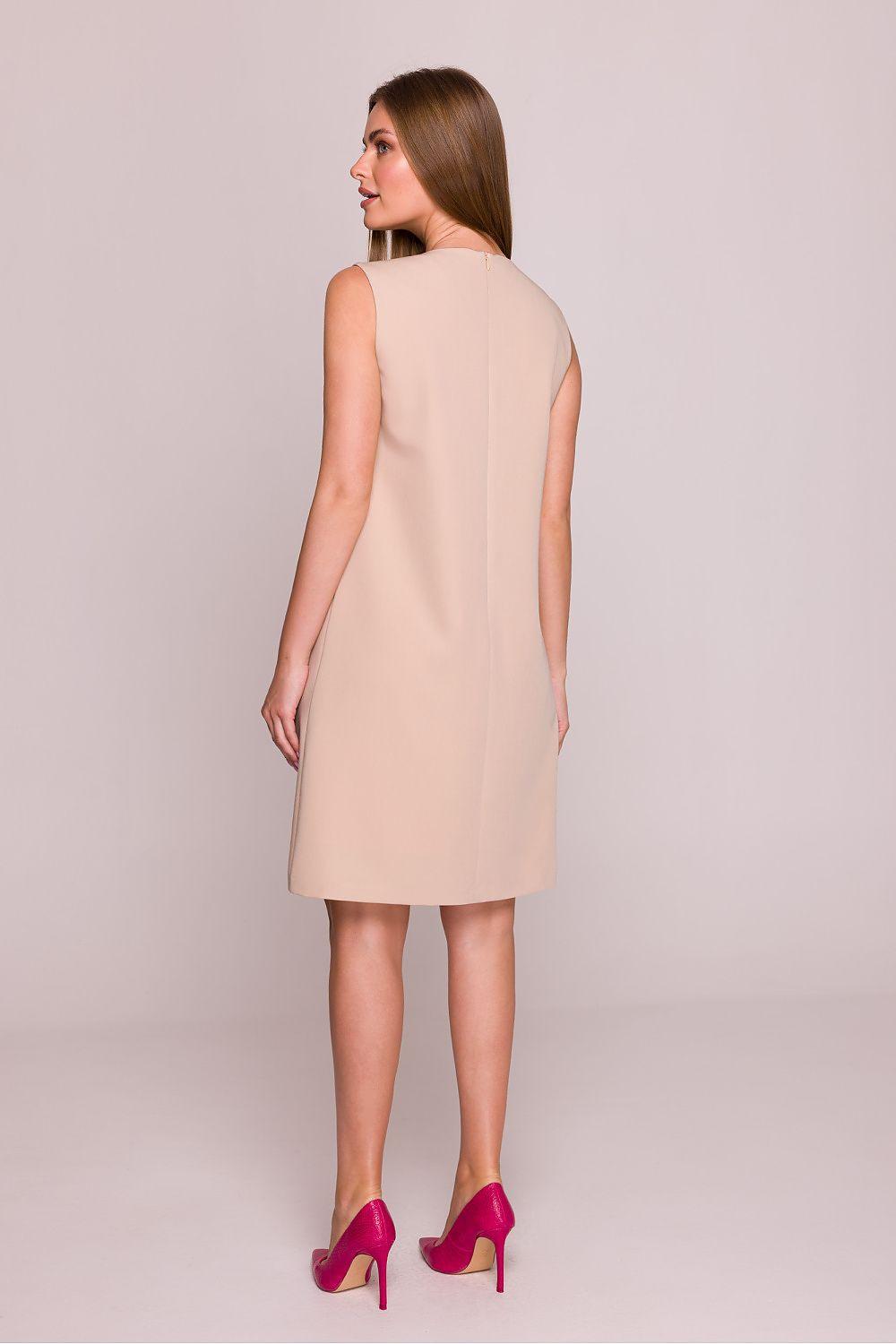 Beige sleeveless day dress viewed from back, round neckline, above-knee length