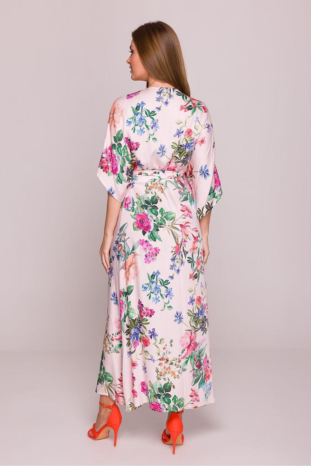 Floral daydress on white background with colorful blooms, tie belt at waist, back view